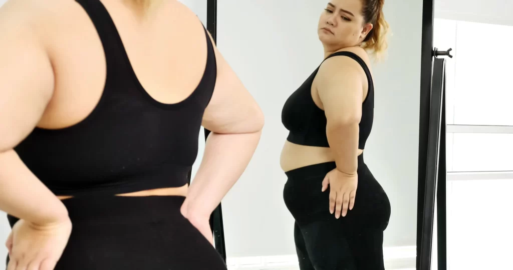 Woman looking in mirror