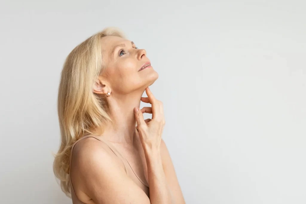 Woman with hand on chin